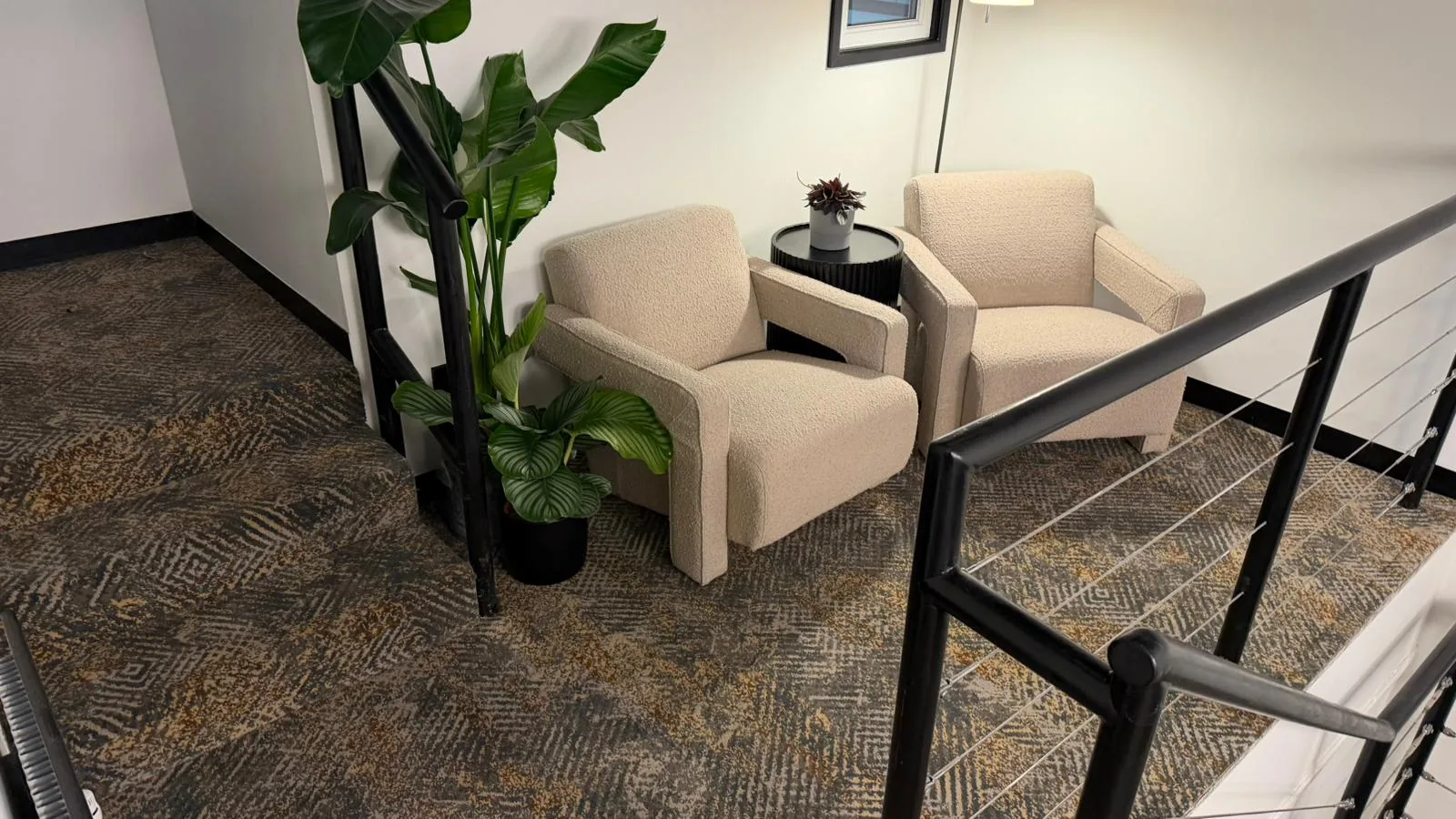 Patterned carpet fitted in a furnished interior